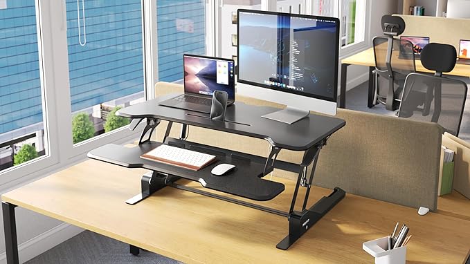 Mount-It! Height Adjustable Standing Desk Converter, 38” Wide, Stand Up Desk Riser for 2 Monitors, Manual Gas Spring Desktop Raises to 16.9", Fits Two Monitor Screens with Keyboard Mouse Tray in Black